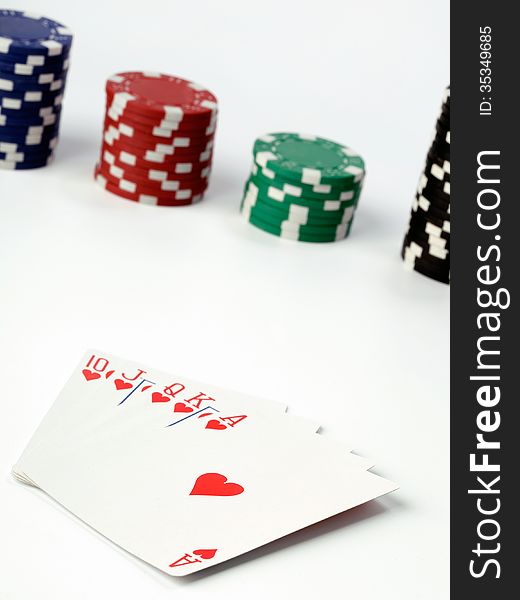 playing cards and poker chips on white