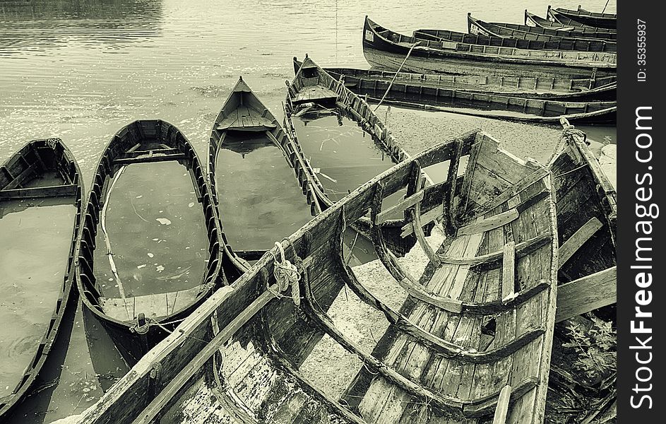 Old fishing boats stranded on the Jurilovca shore, near Danube Delta. Old fishing boats stranded on the Jurilovca shore, near Danube Delta