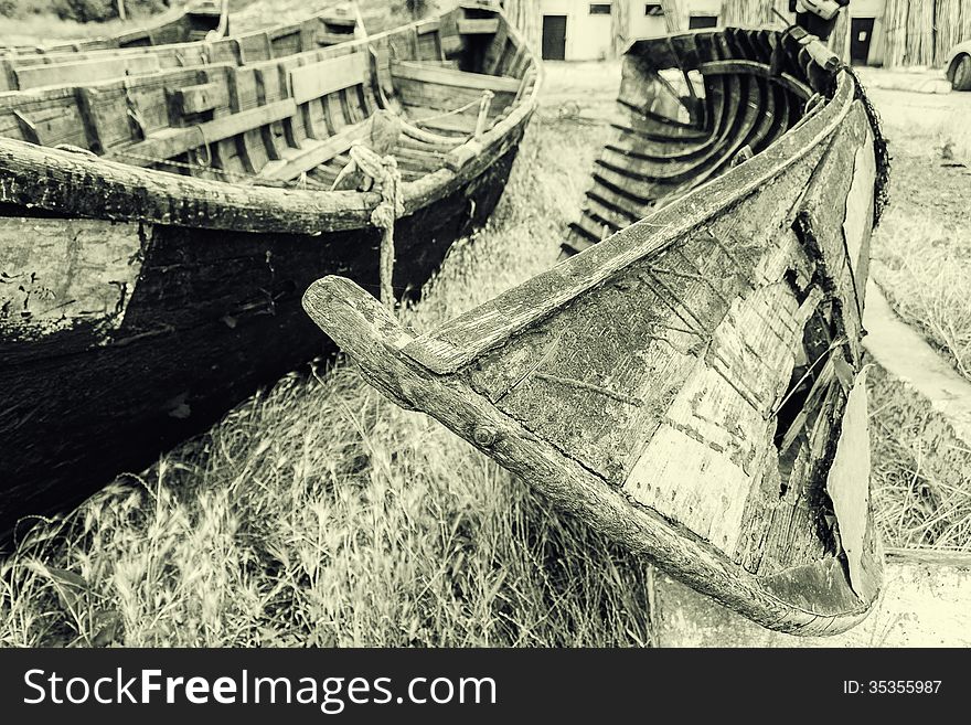 Old fishing boats stranded on the Jurilovca shore, near Danube Delta. Old fishing boats stranded on the Jurilovca shore, near Danube Delta