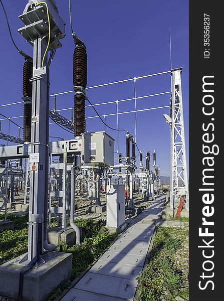 Modern medium voltage distribution station. The station is relatively new (it was builted 2 years ago) and it has almost latest of the technology aplied. Ligtning rod in the right side of the photo. Industrial zone near Brasov. Modern medium voltage distribution station. The station is relatively new (it was builted 2 years ago) and it has almost latest of the technology aplied. Ligtning rod in the right side of the photo. Industrial zone near Brasov.