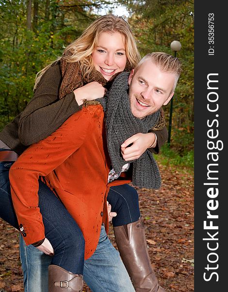 Happy Young Couple In The Autumn