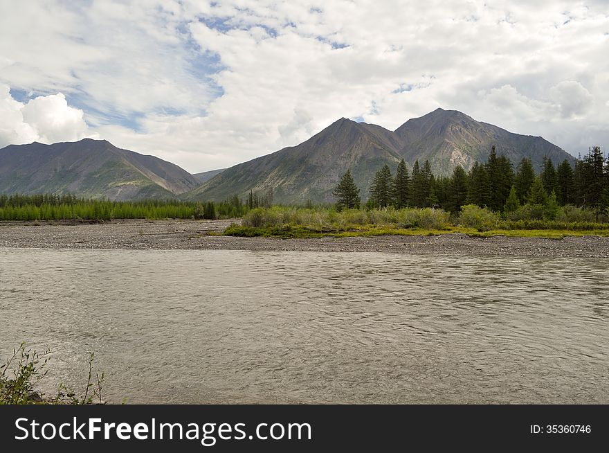 Mountain river Suntar. Landscape of the far corners of the earth in Yakutia. Ridge Suntar-Khayata, Russia. Mountain river Suntar. Landscape of the far corners of the earth in Yakutia. Ridge Suntar-Khayata, Russia.