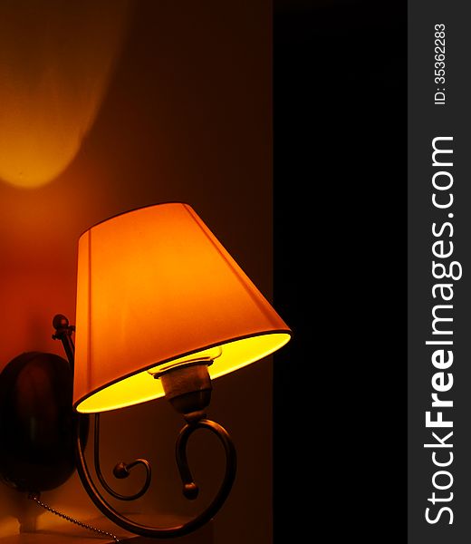 A vintage lamp on a dark, romantic background. A vintage lamp on a dark, romantic background.
