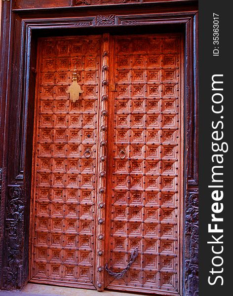Berber brown moroccan riad door and frame. Marrake