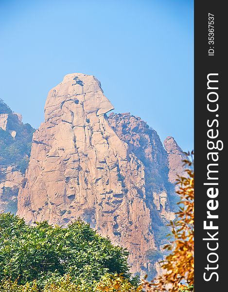 The cliff peak and autumnal scenery