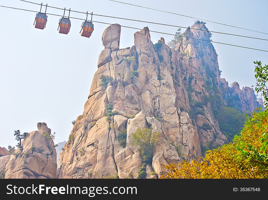 The cliff peak and cable car autumnal scenery