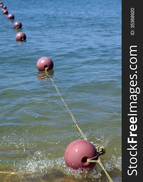 Buoys in the blue sea.
