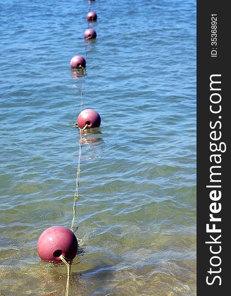 Buoys in the blue sea.