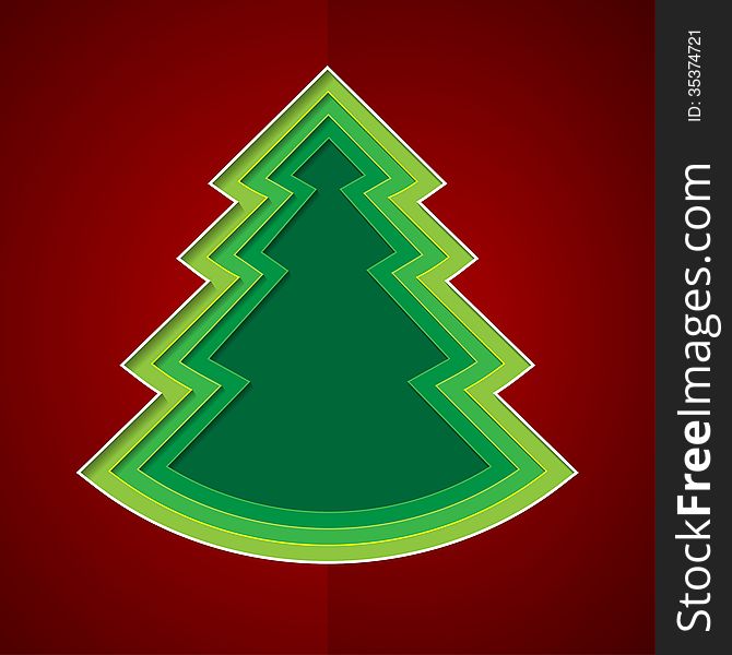 Green paper christmas tree on red background