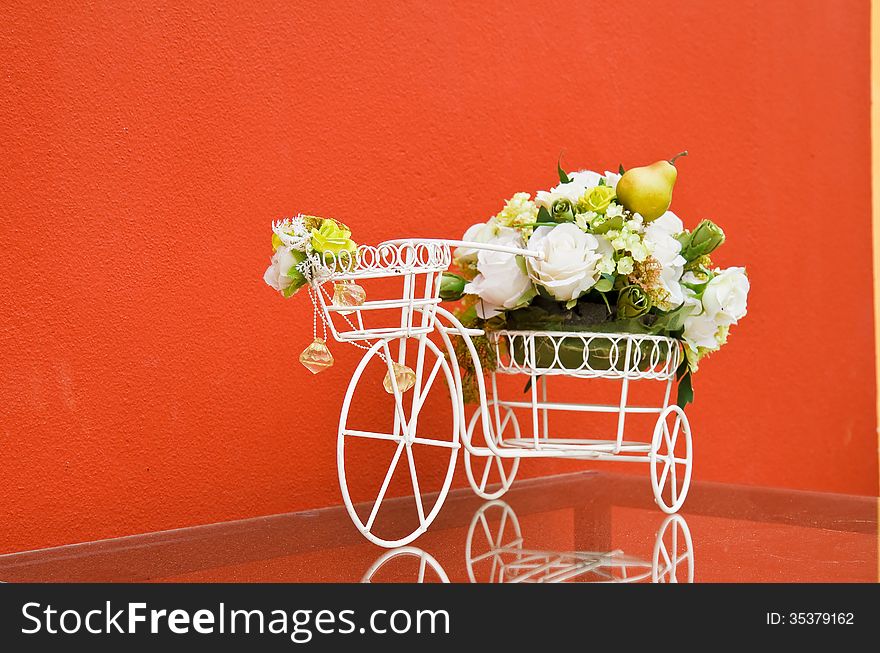 Bicycle with artificial flower in room