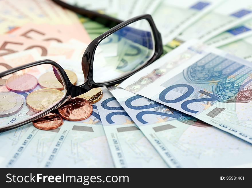 Business concept. Eyeglasses on euro paper currency background. Business concept. Eyeglasses on euro paper currency background