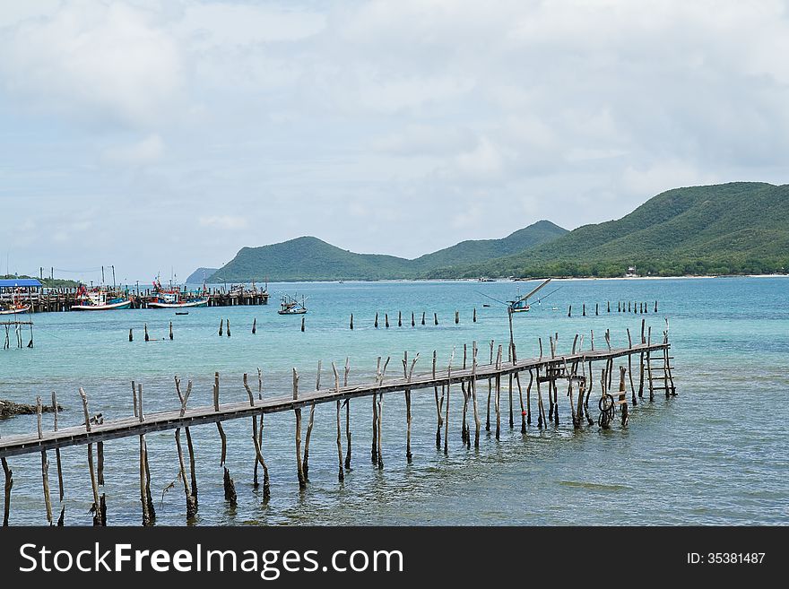 Wooden bridge to the sea,Thailand