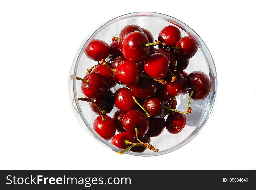 Glass bowl of juicy red cherries. Glass bowl of juicy red cherries.