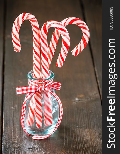 Christmas candy canes in glass jar