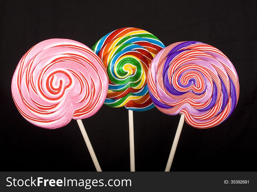 Colorful lollipops on a black background