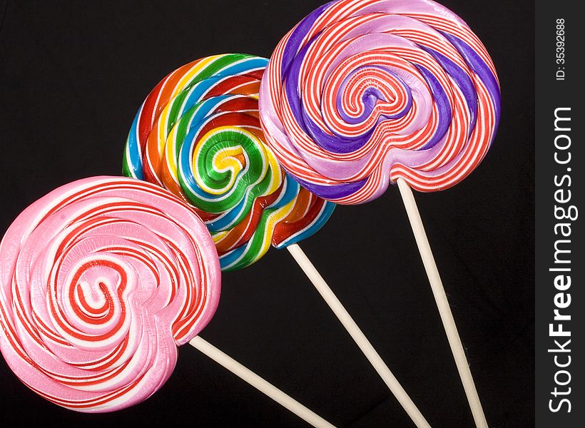 Colorful lollipops on a black background