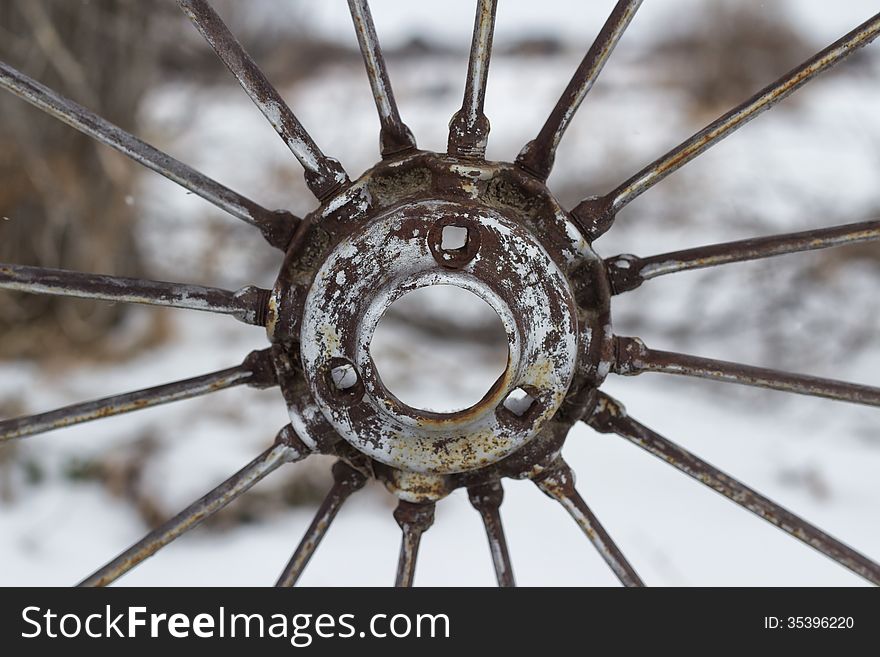 S rusty wheel sprocket with extending spokes. S rusty wheel sprocket with extending spokes