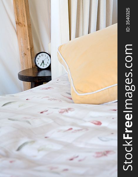 Clock next to bed in calm sleep colors. Clock next to bed in calm sleep colors