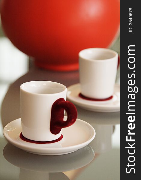 White coffee cup with red plush handle