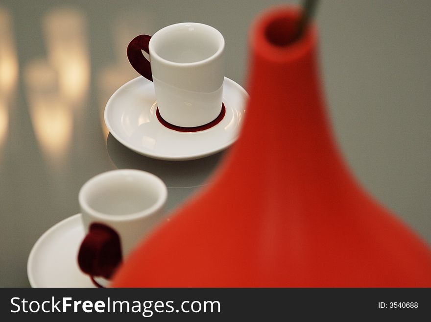 White coffee cup with red plush handle