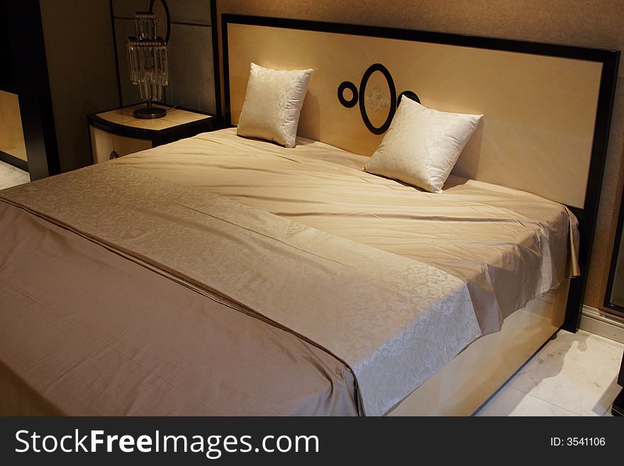 Double bed with bedstand and reading lamp. Double bed with bedstand and reading lamp