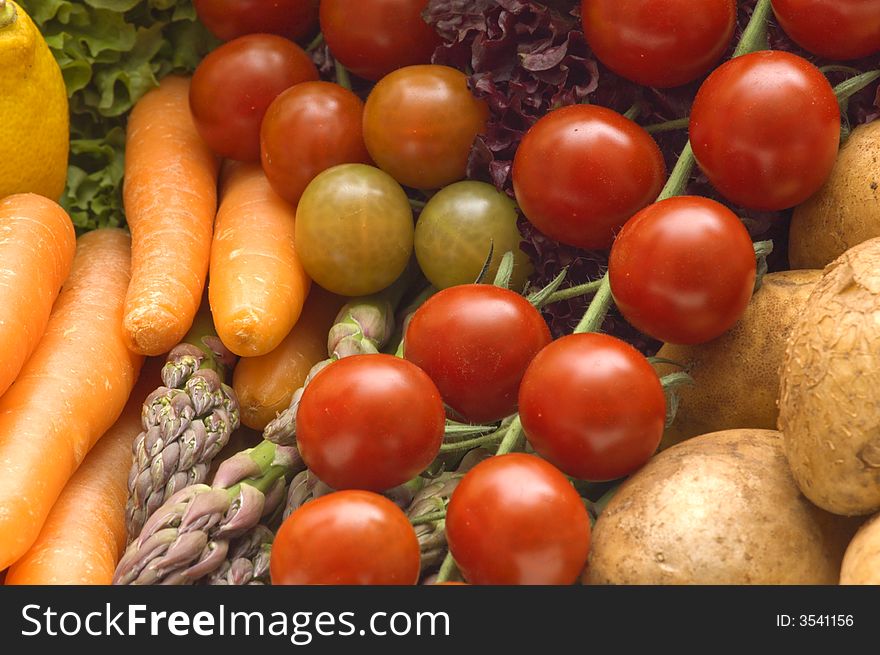 Fresh tomatoes on vegetables background. Fresh tomatoes on vegetables background