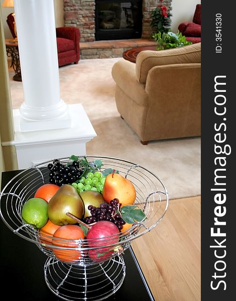 Colorful fruits decorated in a bowl on kitchen counter top. Colorful fruits decorated in a bowl on kitchen counter top
