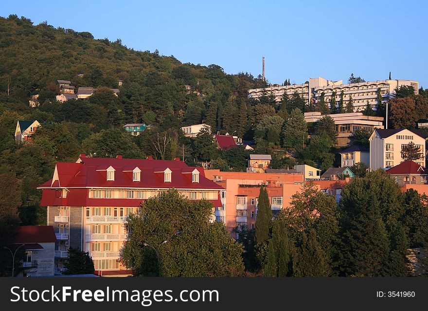 Tropical resort in the mountains with buildings and tower