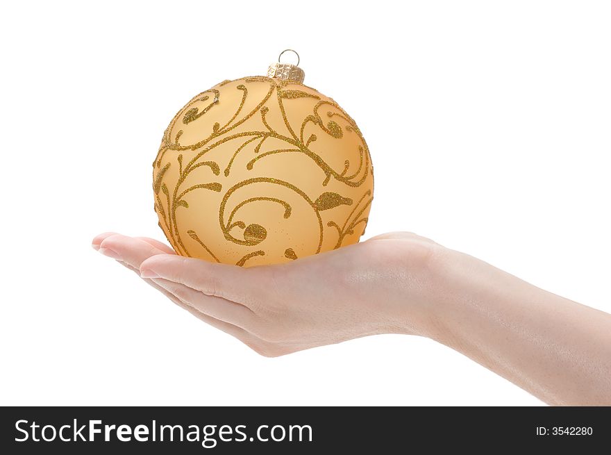 Hand with golden christmas ball on white background