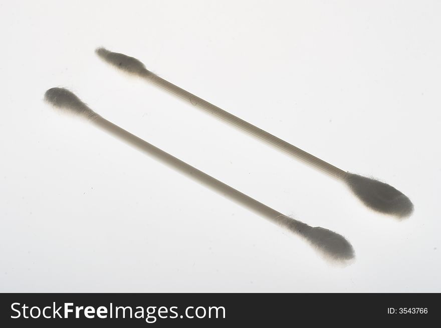 Sticks with cotton applicators for a make-up on a white background. Sticks with cotton applicators for a make-up on a white background
