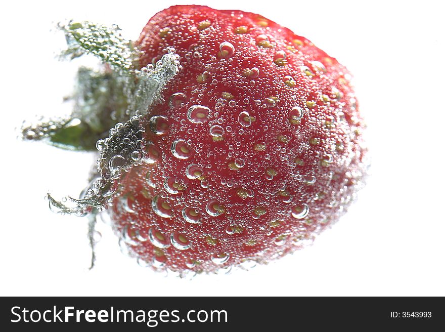 Bright red strawberry on a white background