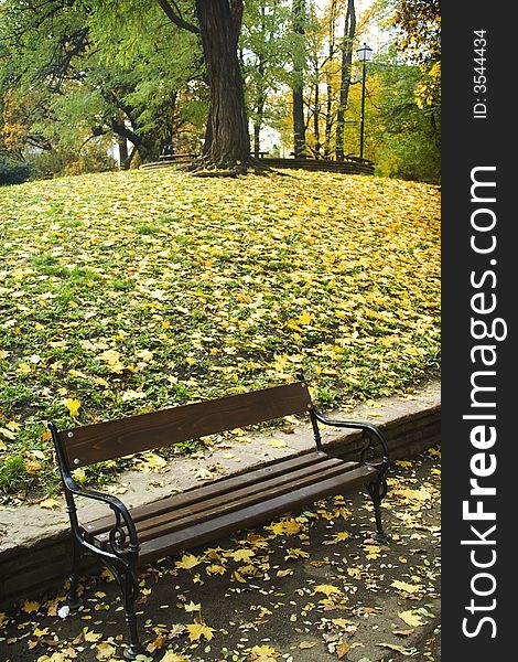 Nice view from a park in the Autumn with bench. Nice view from a park in the Autumn with bench