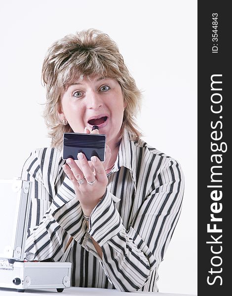 Woman applying lipstick with white background