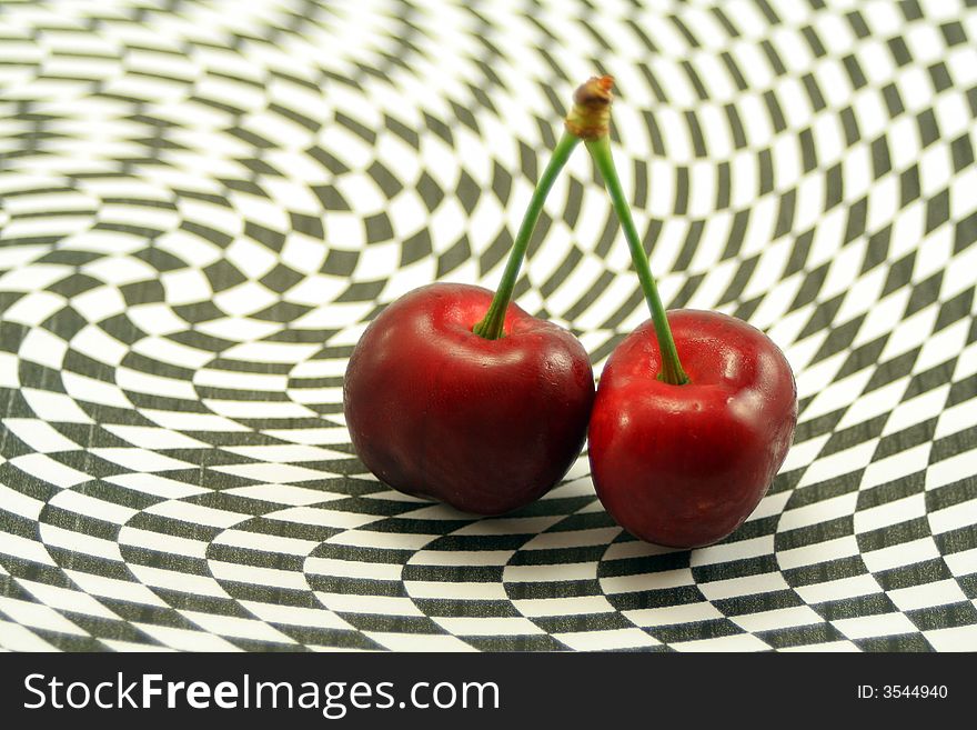 Delicious cherries on an abstract black and white background