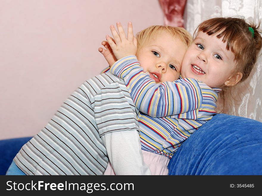 The boy in embraces of the girl. Children age 2 years. The boy in embraces of the girl. Children age 2 years