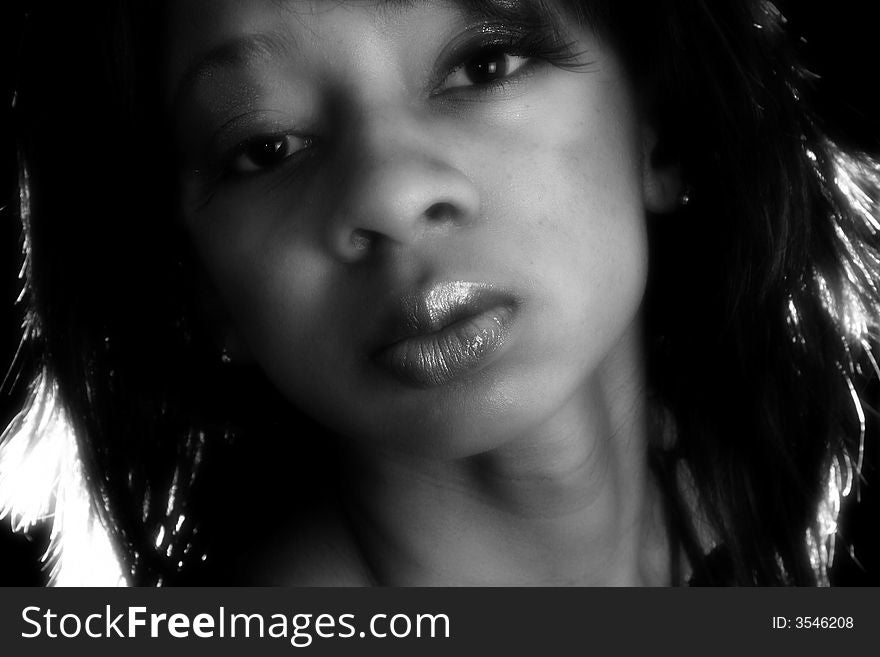 Beautiful young African American woman in black and white portriat. Beautiful young African American woman in black and white portriat.