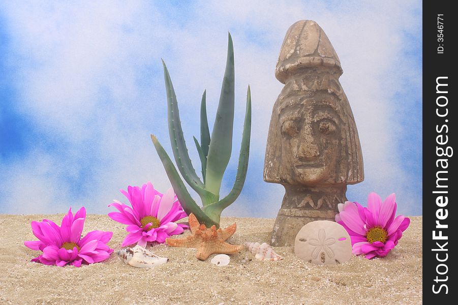 Aloe Plant and Statue on Sand With Blue Sky Background. Aloe Plant and Statue on Sand With Blue Sky Background