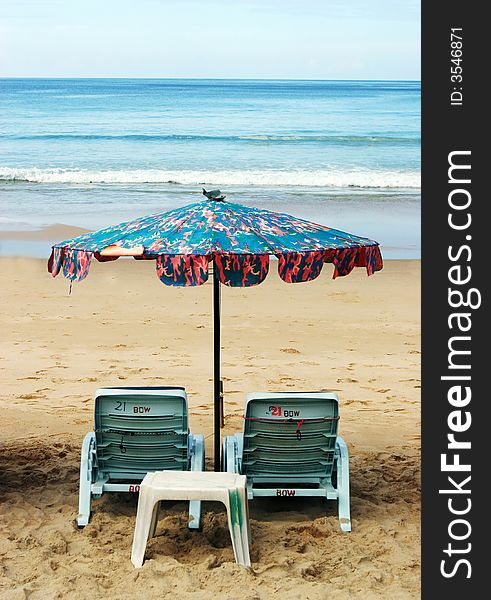 Deck chairs at the beach - summertime scenic.