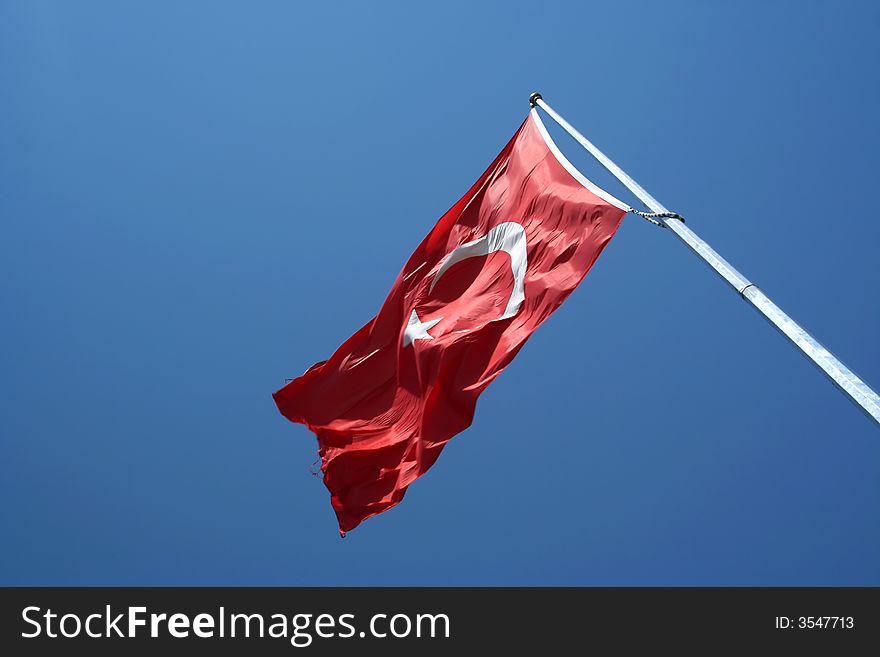 National flag of Turkey nder blue sky