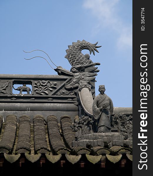 Edge of a chinese temple roof with little figures on it. Edge of a chinese temple roof with little figures on it