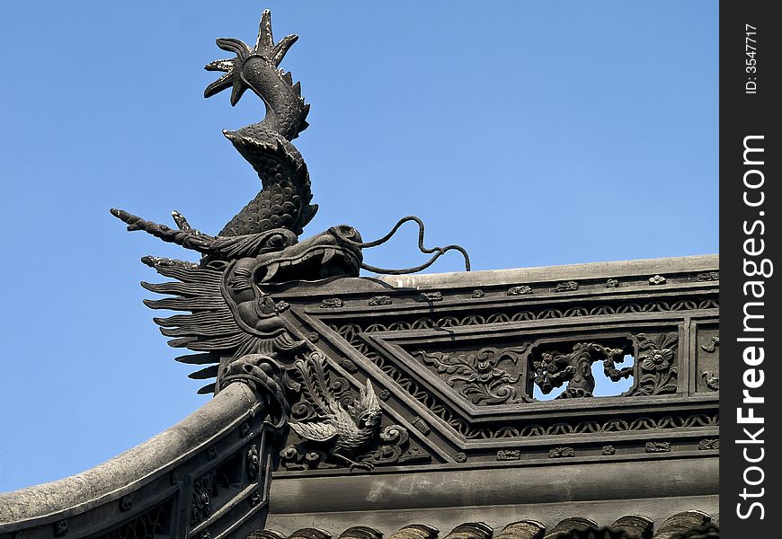 Edge of a chinese temple roof with little figures on it. Edge of a chinese temple roof with little figures on it