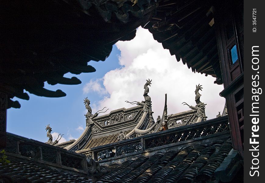 Edge of a chinese temple roof with little figures on it. Edge of a chinese temple roof with little figures on it