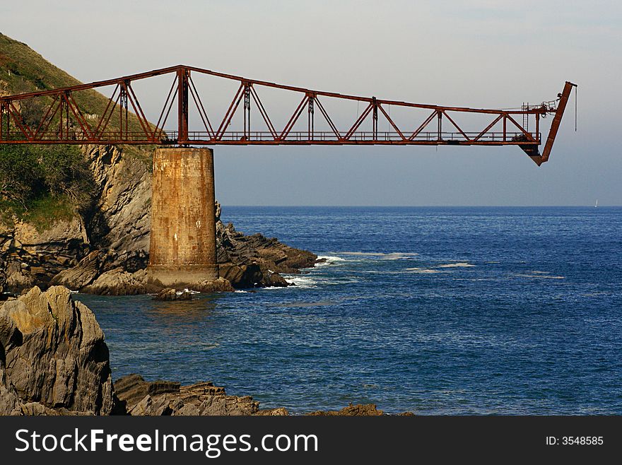 An image of an Old cargo building by the sea in Spain.