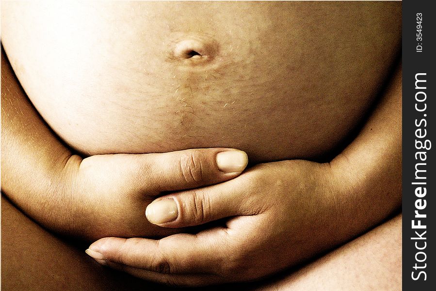 Pregnant woman, close-up photo of stomach. Pregnant woman, close-up photo of stomach.