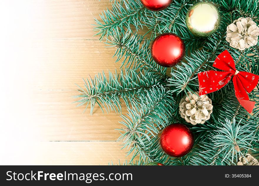 Christmas fir tree with decoration on a wooden board. Christmas fir tree with decoration on a wooden board