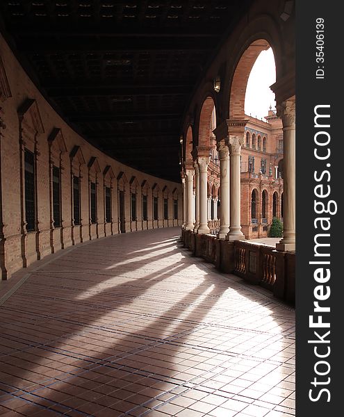 Ancient colonnade in palace. Plaza de Espana, Seville, Spain