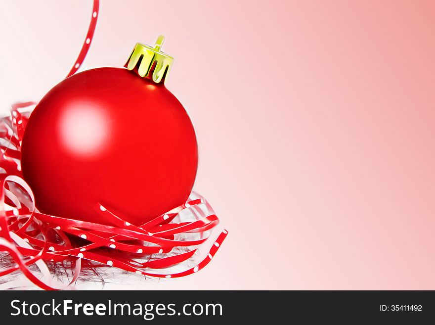 Red christmas ball with ribbon