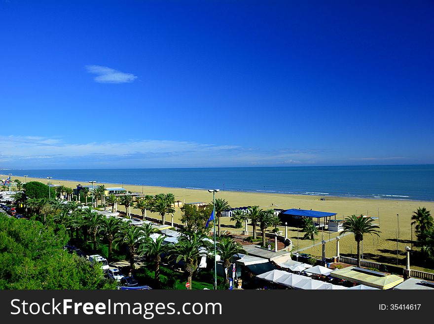 The deserted beach looks inviting against the blue sky. The deserted beach looks inviting against the blue sky.