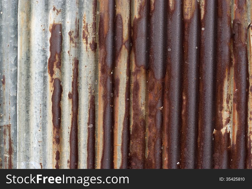 A rusty corrugated iron plate