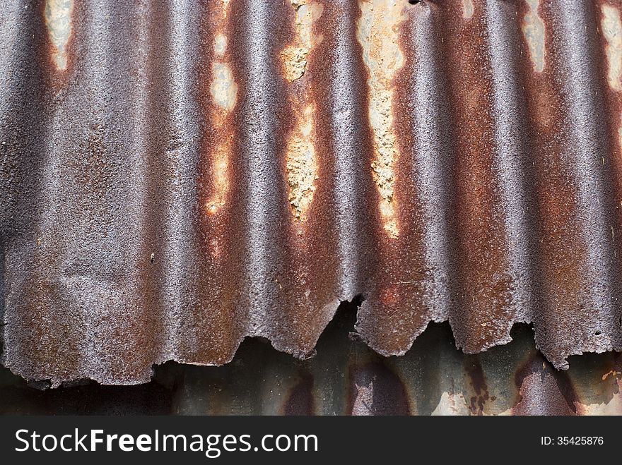 A rusty corrugated iron plate